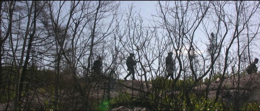 Rangers walking through an interesting landscape.